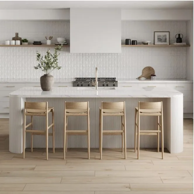 Finished kitchen with a fluted stone island